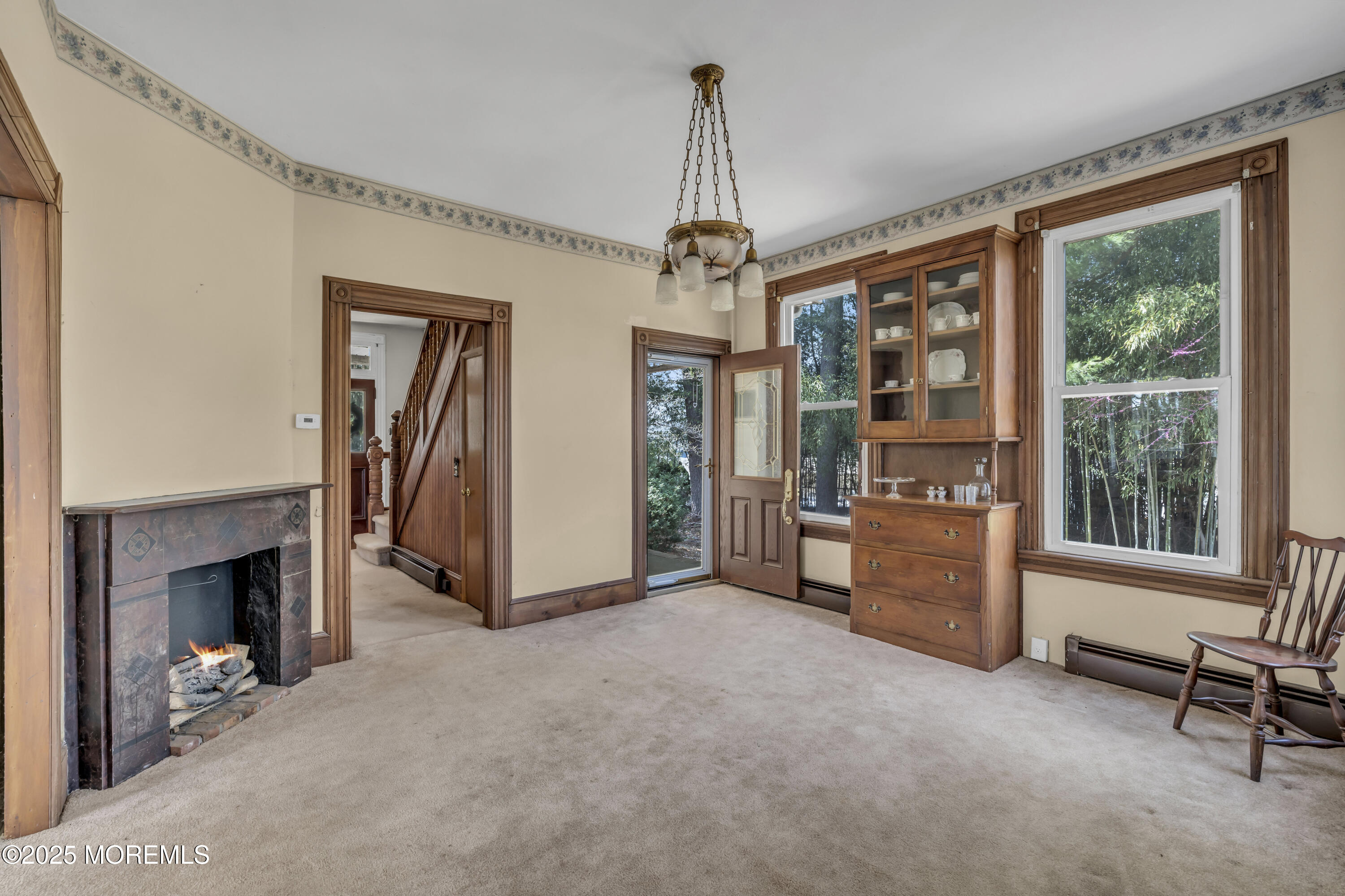 627 Beers Street Hazlet, NJ 07730 - Photo 23 of 64 a view of livingroom with furniture fireplace and window