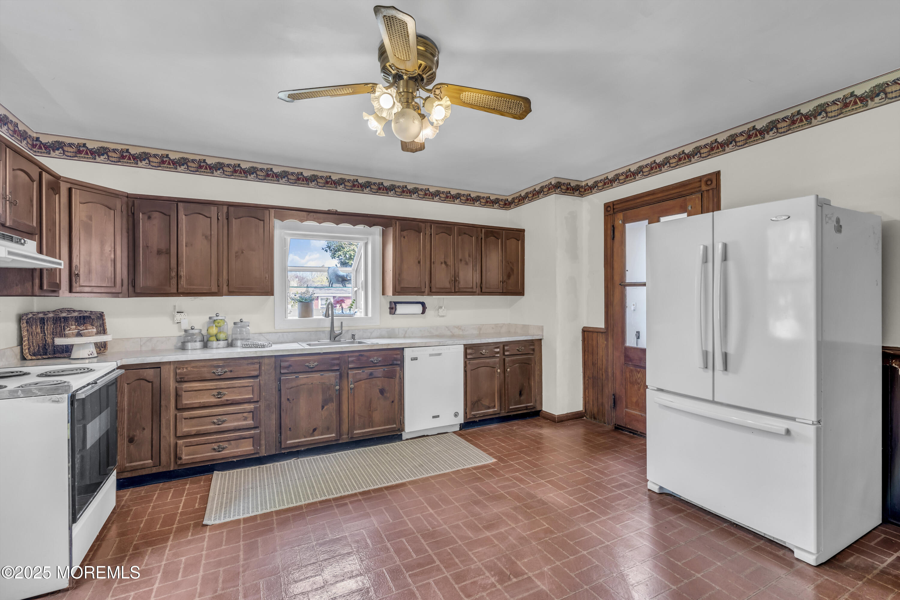 627 Beers Street Hazlet, NJ 07730 - Photo 24 of 64 a kitchen with a refrigerator a sink and dishwasher with wooden floor