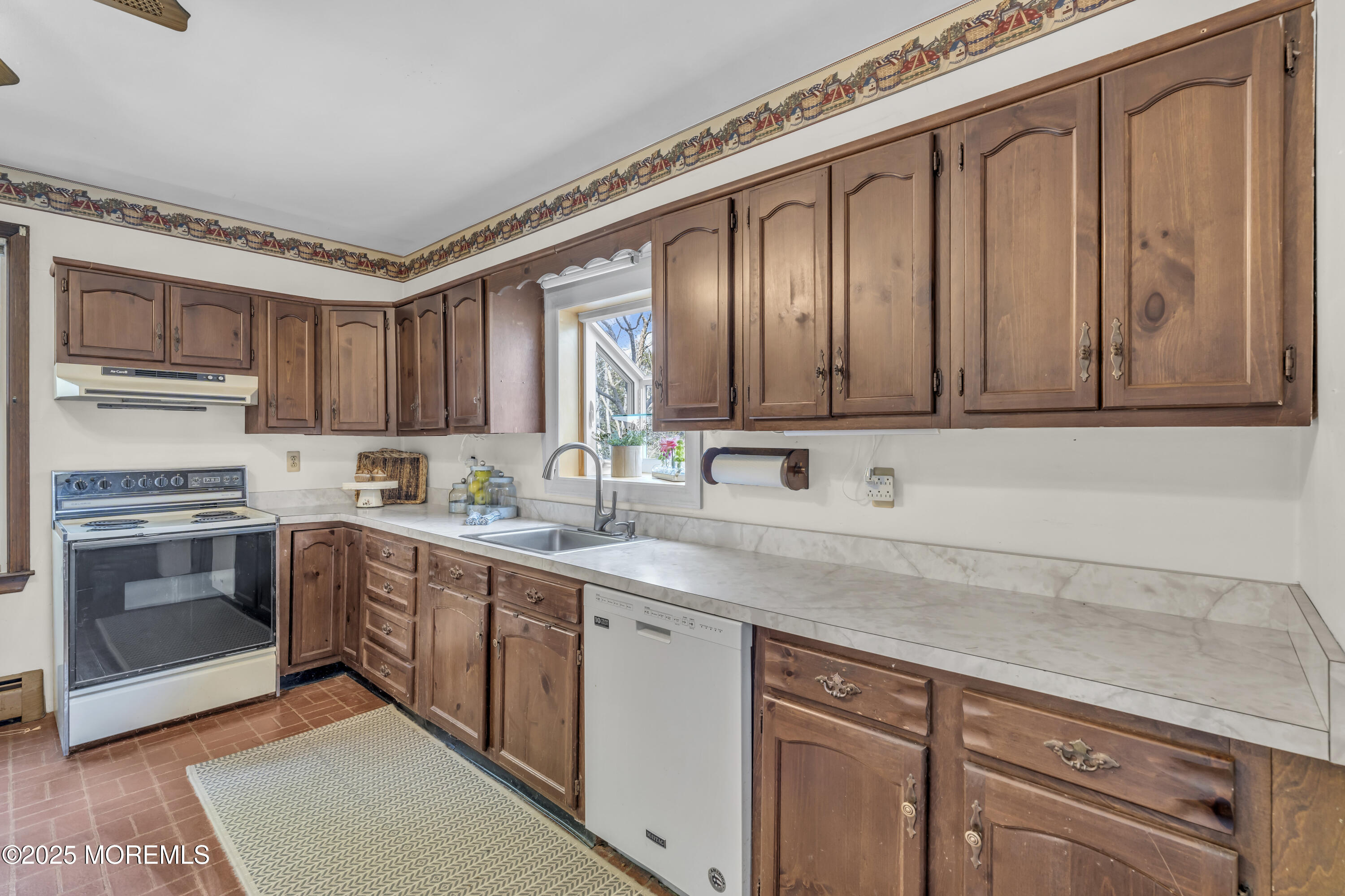 627 Beers Street Hazlet, NJ 07730 - Photo 25 of 64 a kitchen with stainless steel appliances granite countertop a stove and a sink