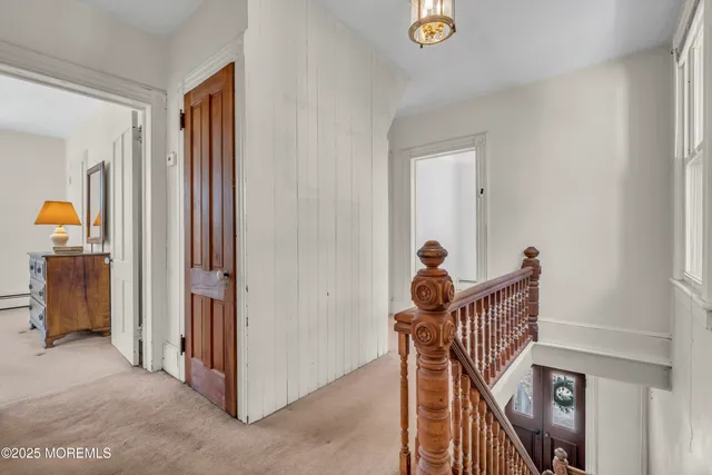 a backyard of a house with a yard and outdoor seating