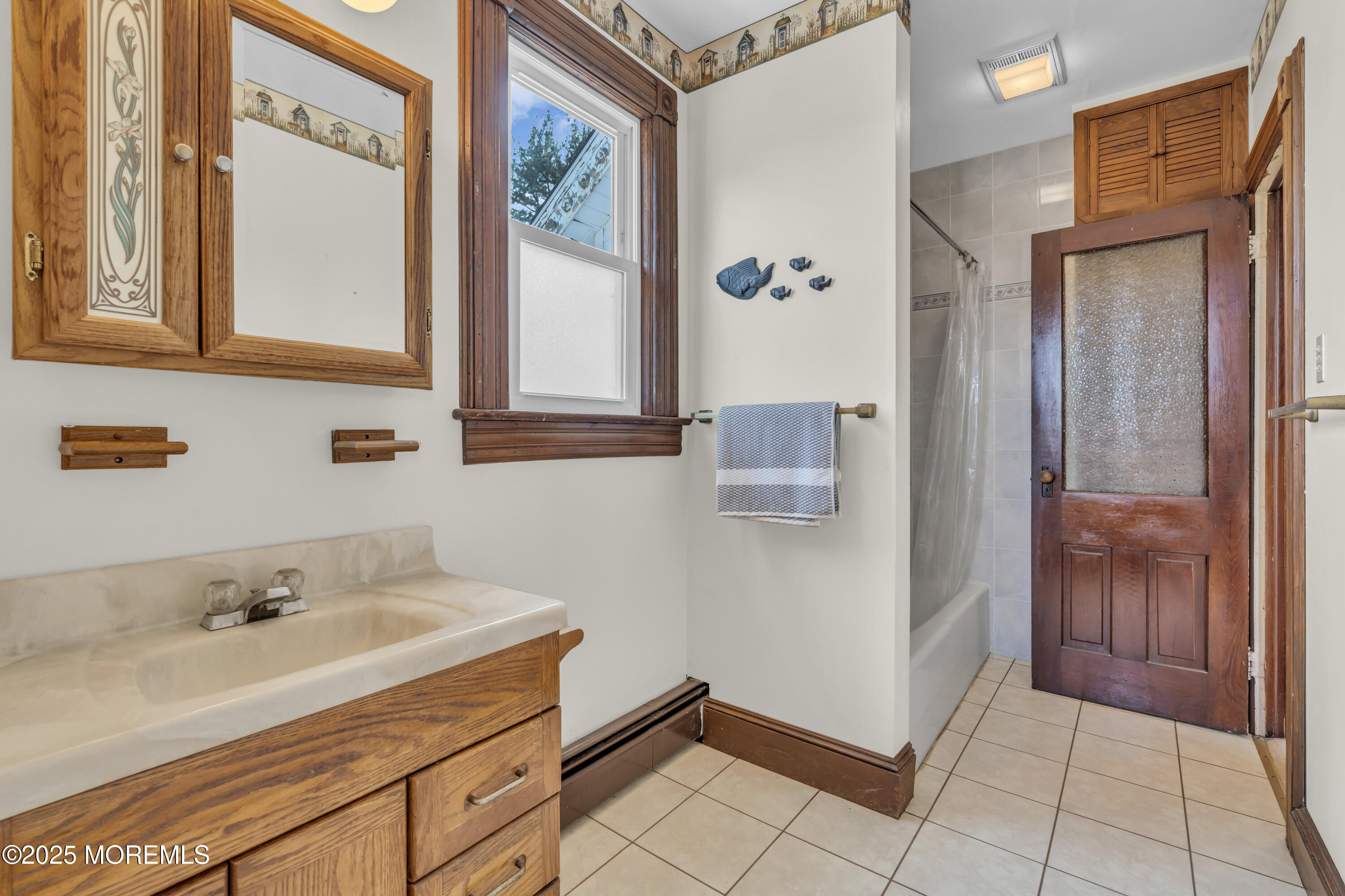 627 Beers Street Hazlet, NJ 07730 - Photo 37 of 64 a bathroom with a sink and a mirror