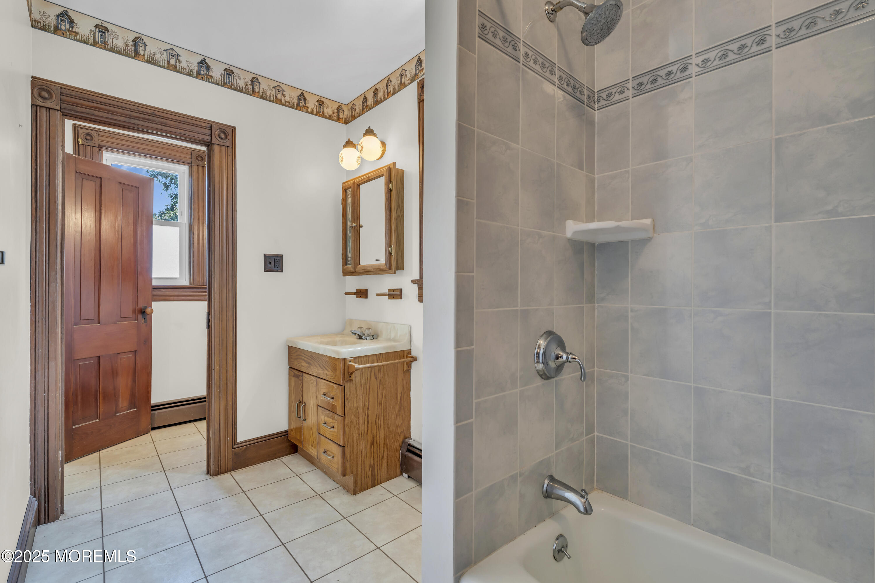 627 Beers Street Hazlet, NJ 07730 - Photo 38 of 64 a bathroom with a tub a sink and a mirror