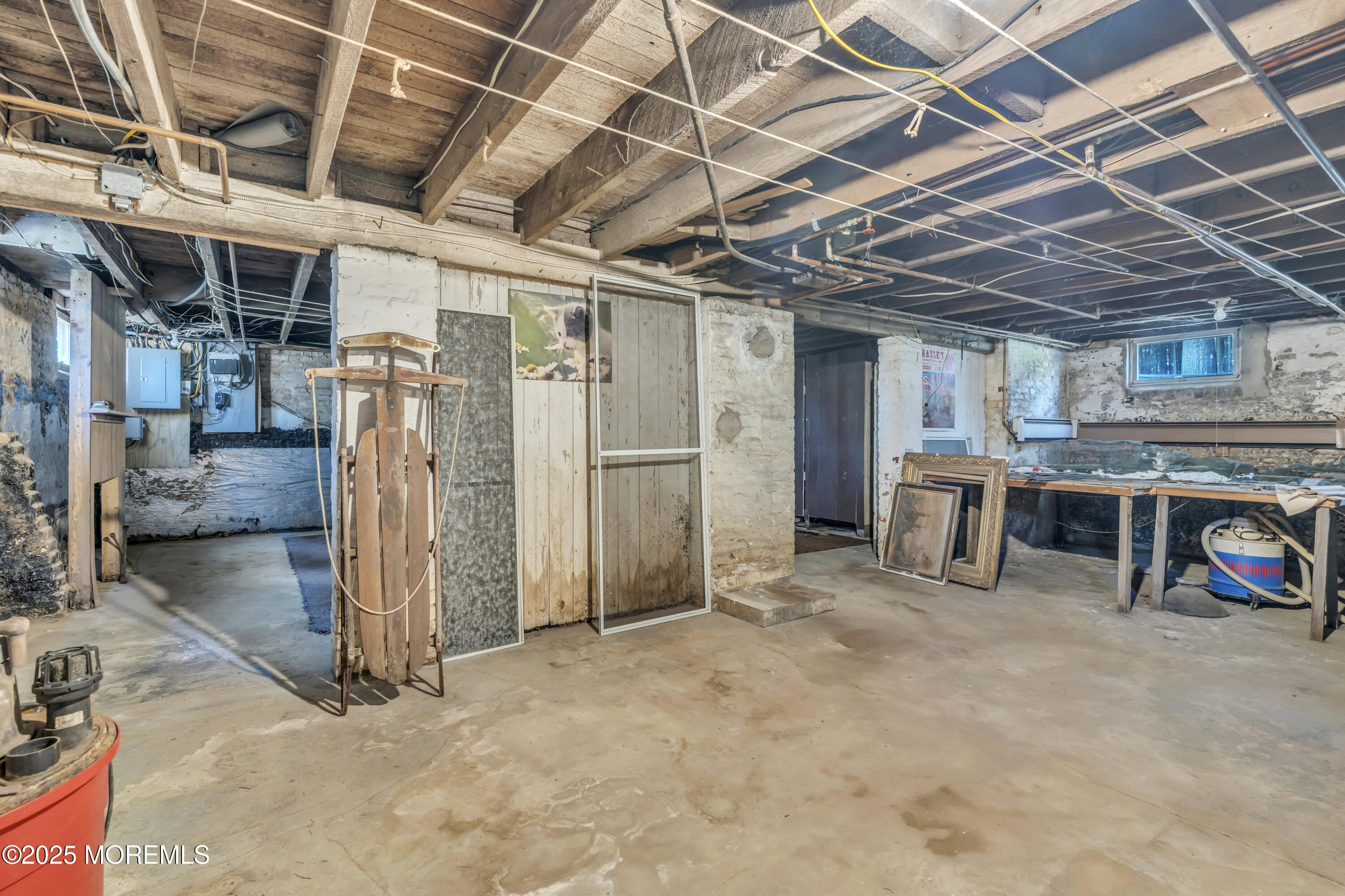 627 Beers Street Hazlet, NJ 07730 - Photo 42 of 64 a view of a storage room with a utility room