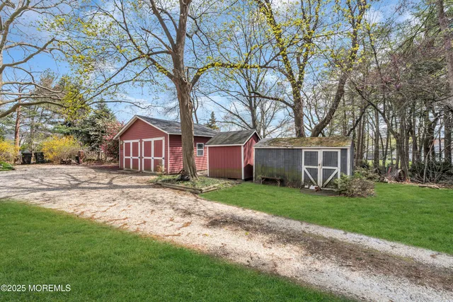 a view of a backyard with sitting area