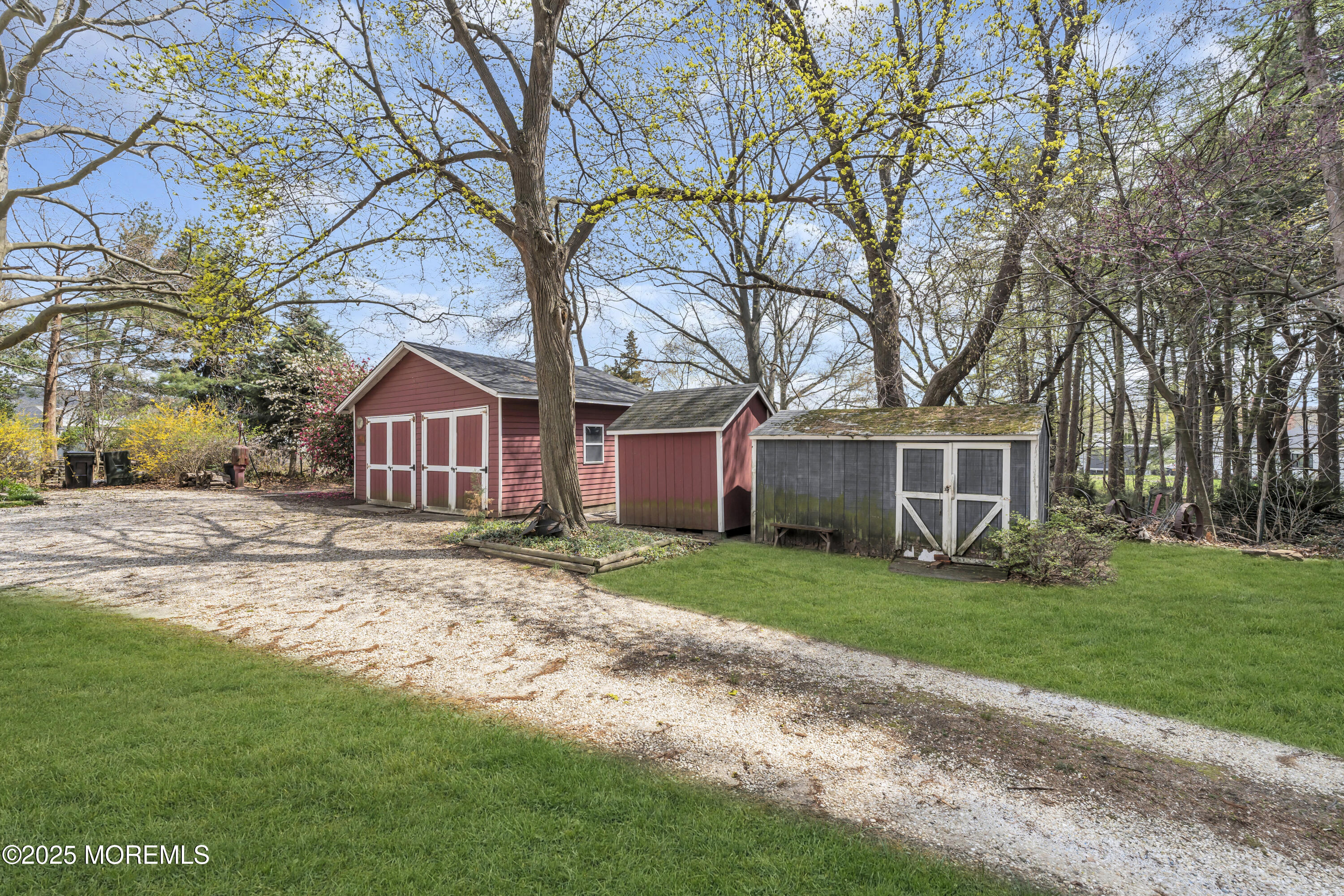 627 Beers Street Hazlet, NJ 07730 - Photo 44 of 64 a front view of a house with a garden and trees