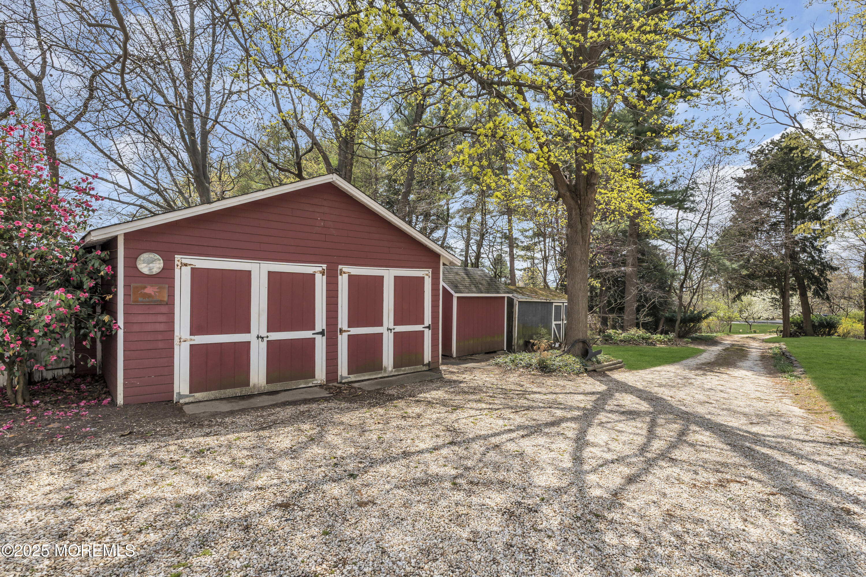 627 Beers Street Hazlet, NJ 07730 - Photo 45 of 64 a front view of a house with a yard and garage