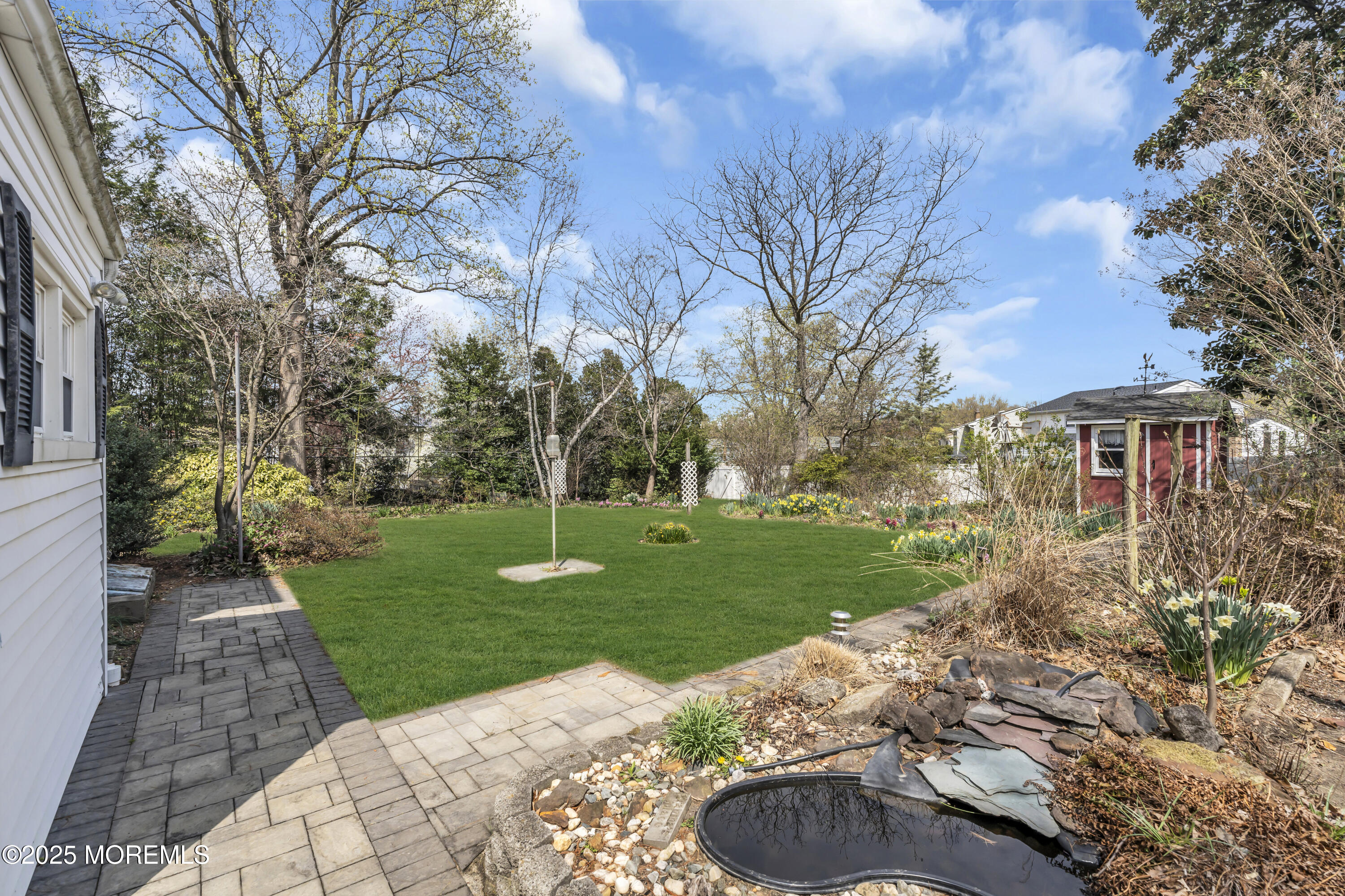 627 Beers Street Hazlet, NJ 07730 - Photo 46 of 64 a backyard of a house with lots of green space