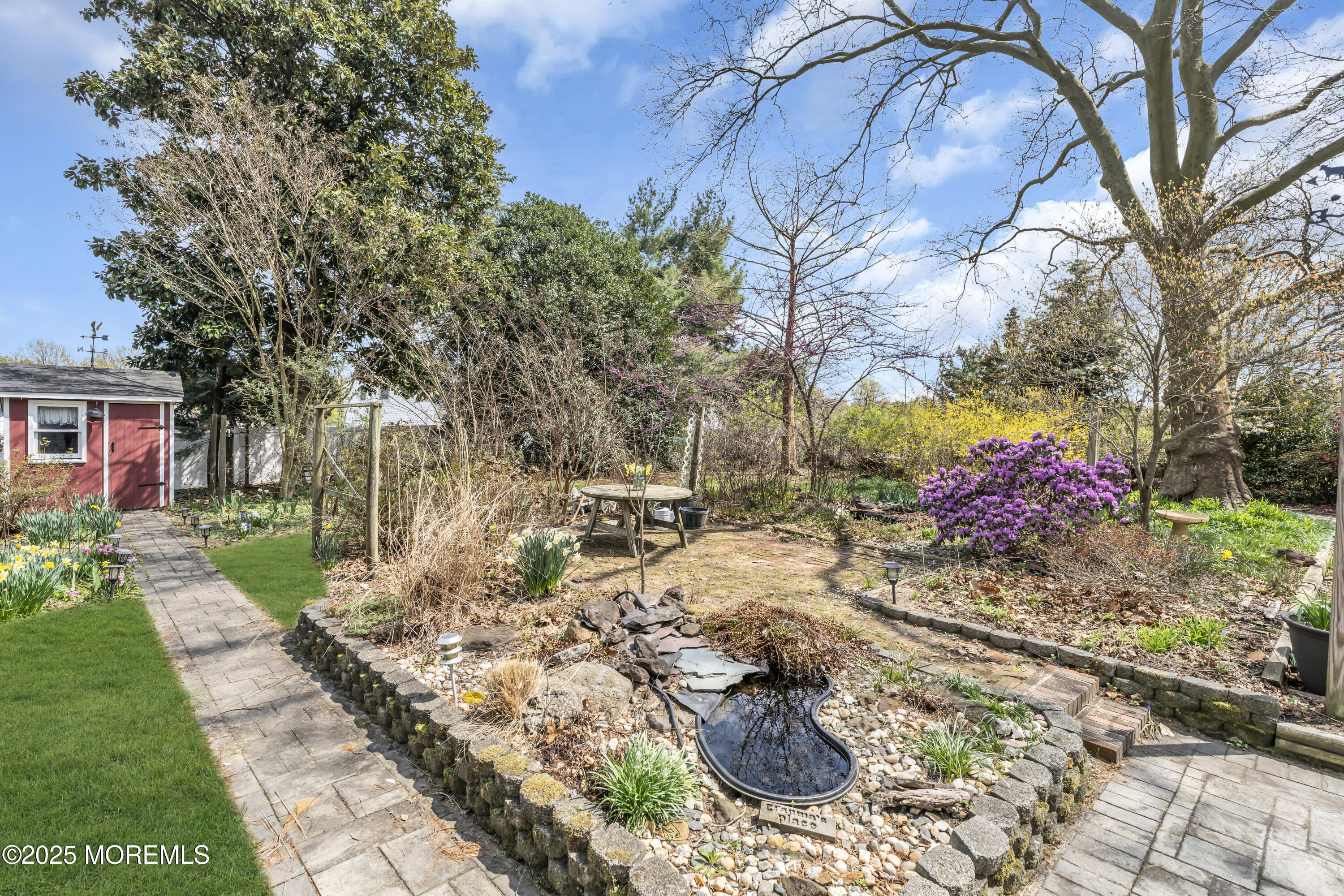 627 Beers Street Hazlet, NJ 07730 - Photo 47 of 64 a backyard of a house with a yard and outdoor seating