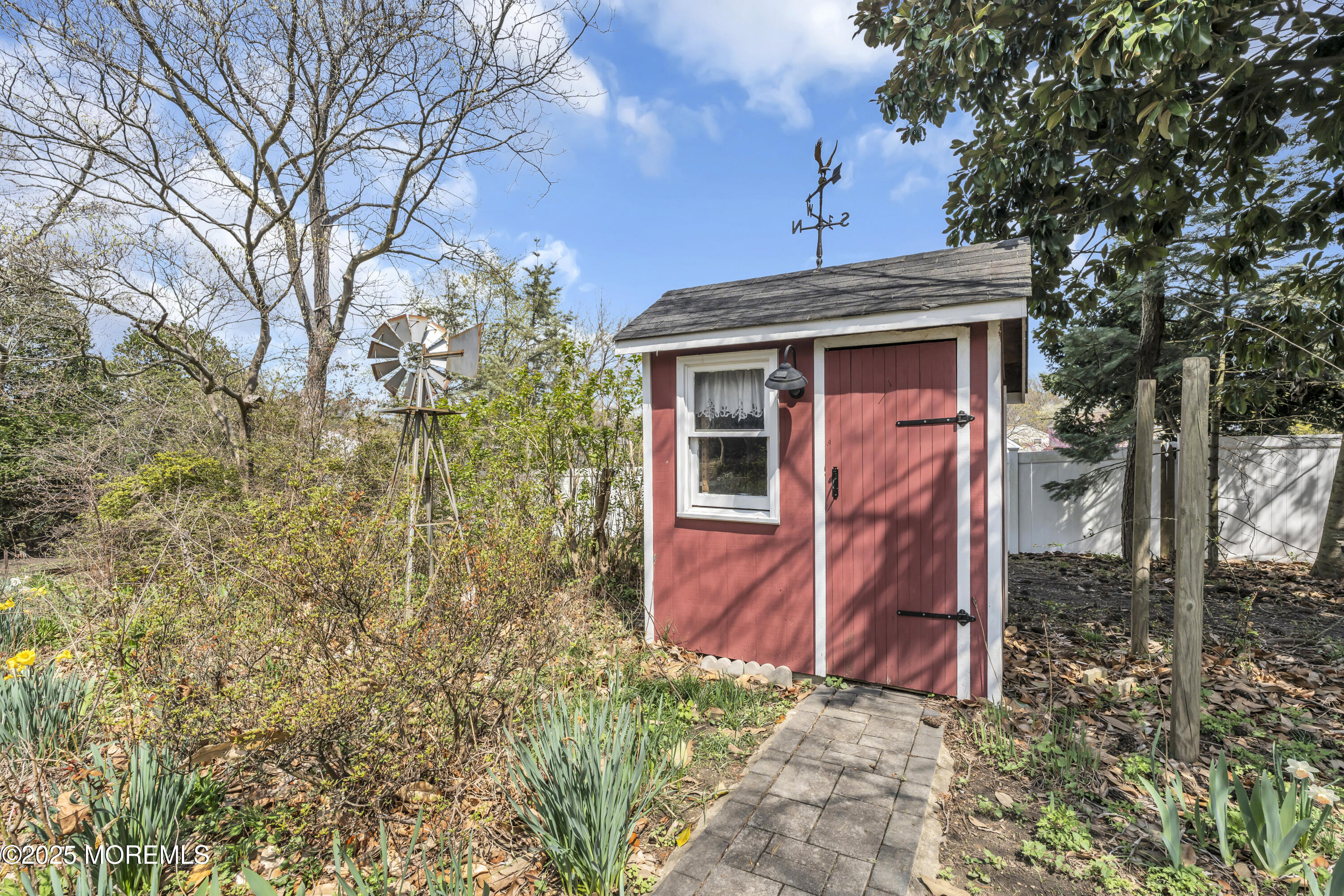 627 Beers Street Hazlet, NJ 07730 - Photo 49 of 64 a view of a house with a small yard and large tree