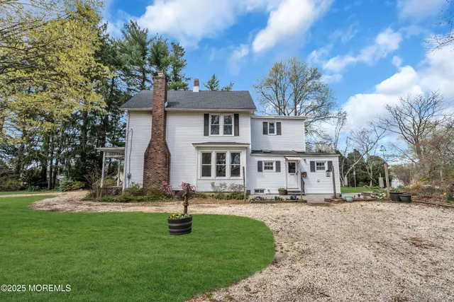 a view of a backyard with sitting area