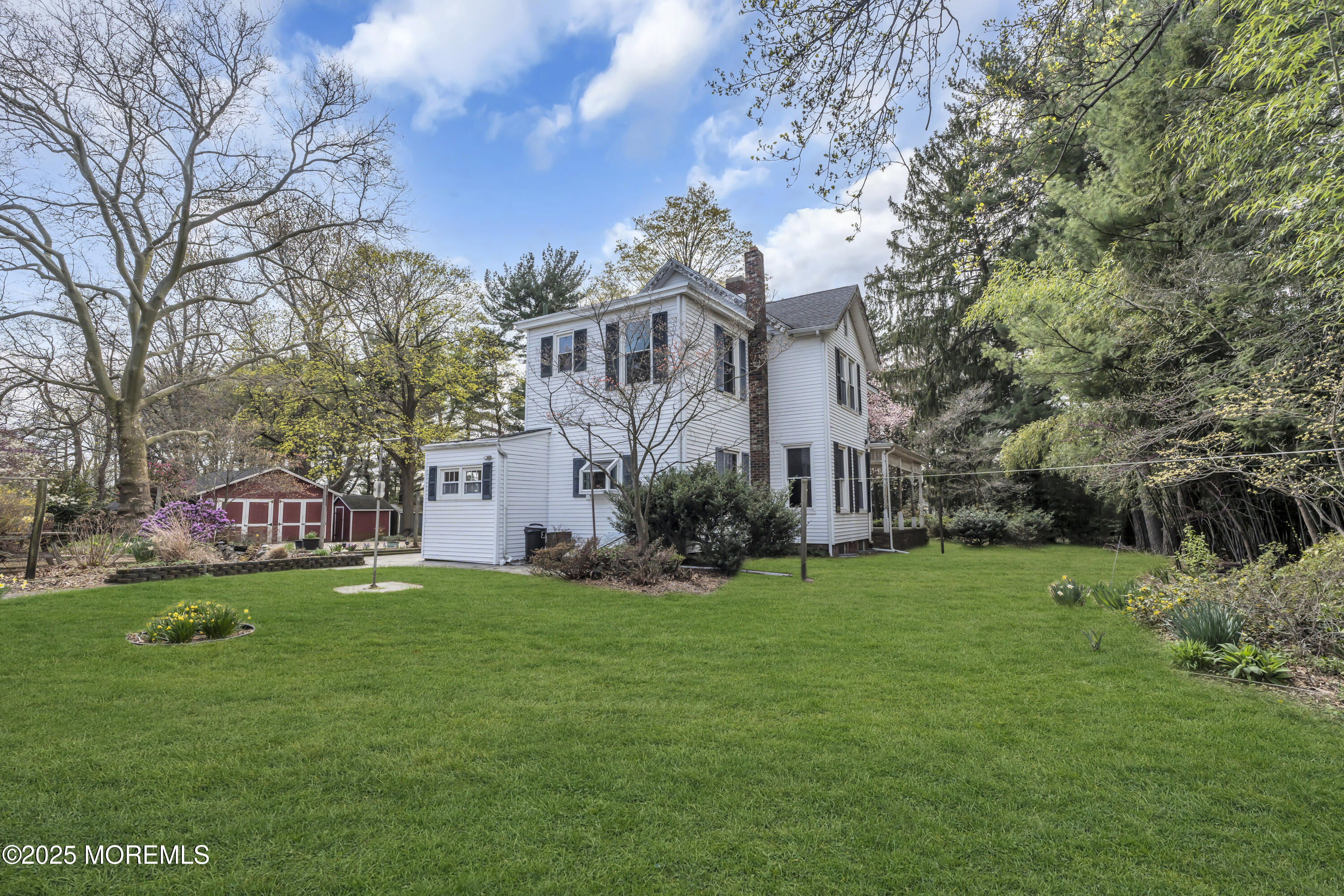 627 Beers Street Hazlet, NJ 07730 - Photo 53 of 64 a front view of a house with a garden
