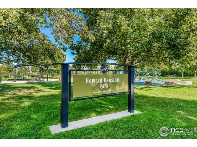 a view of a park with large trees
