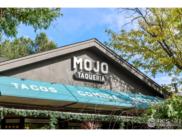 a black and white building with a outdoor space