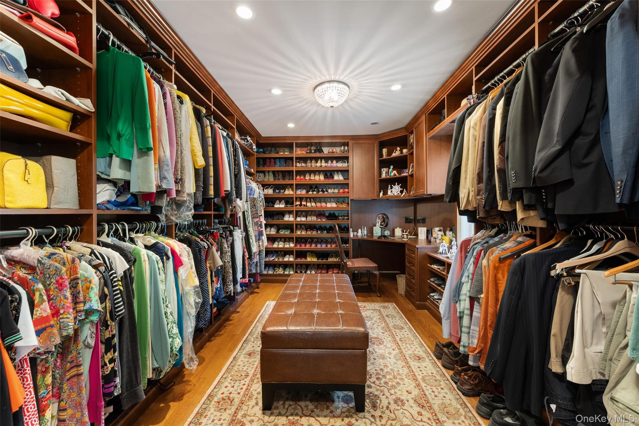 5 Cooper Road Scarsdale, NY 10583 - Photo 23 of 46 Primary walk in closet with custom built in cabinetry