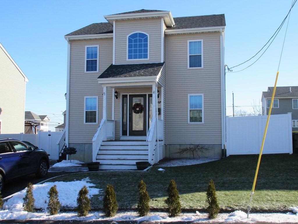 418 Smith Street Fall River, MA 02721 - Photo 1 of 37 a front view of a house with garden