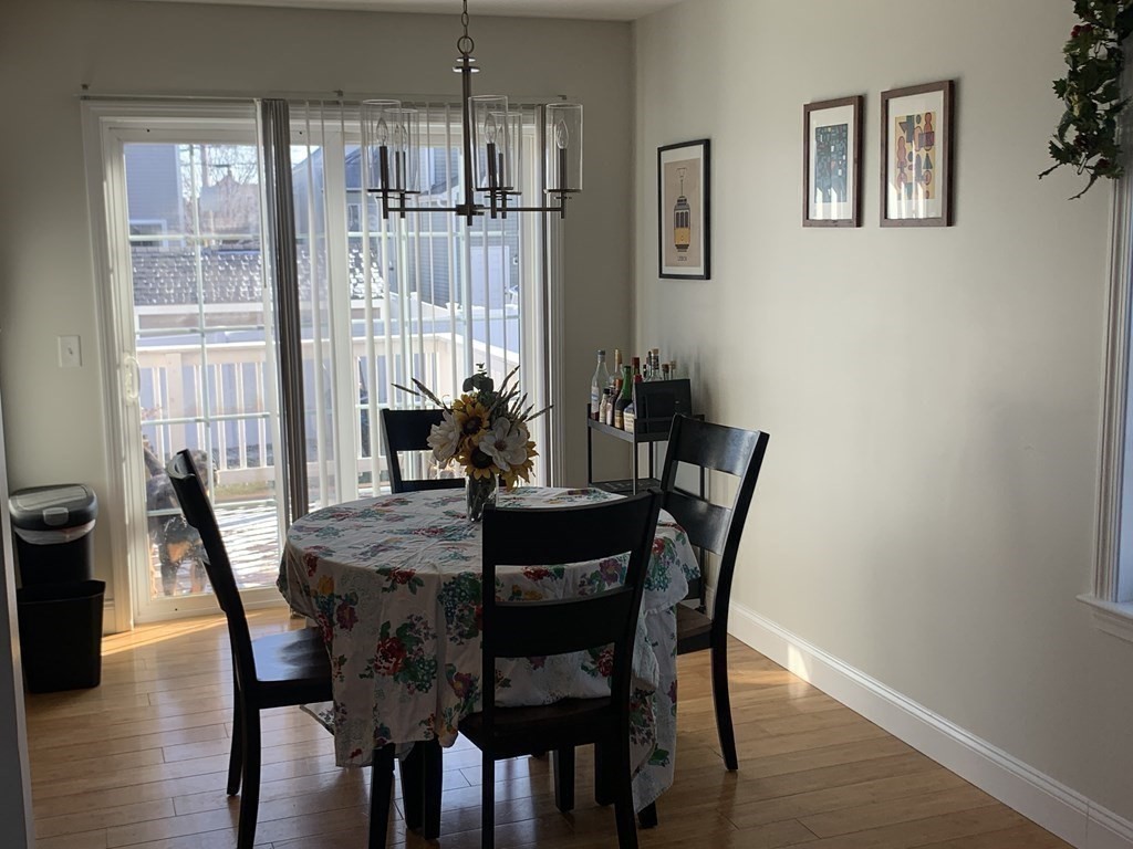 418 Smith Street Fall River, MA 02721 - Photo 12 of 37 a view of a dining room with furniture window and wooden floor