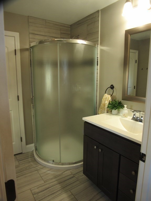 418 Smith Street Fall River, MA 02721 - Photo 21 of 37 a bathroom with a sink shower and a mirror