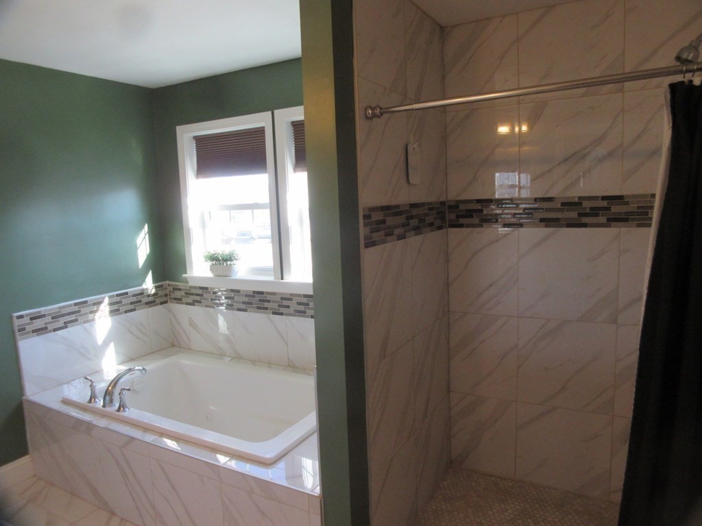 418 Smith Street Fall River, MA 02721 - Photo 26 of 37 a bath tub sitting next to a window