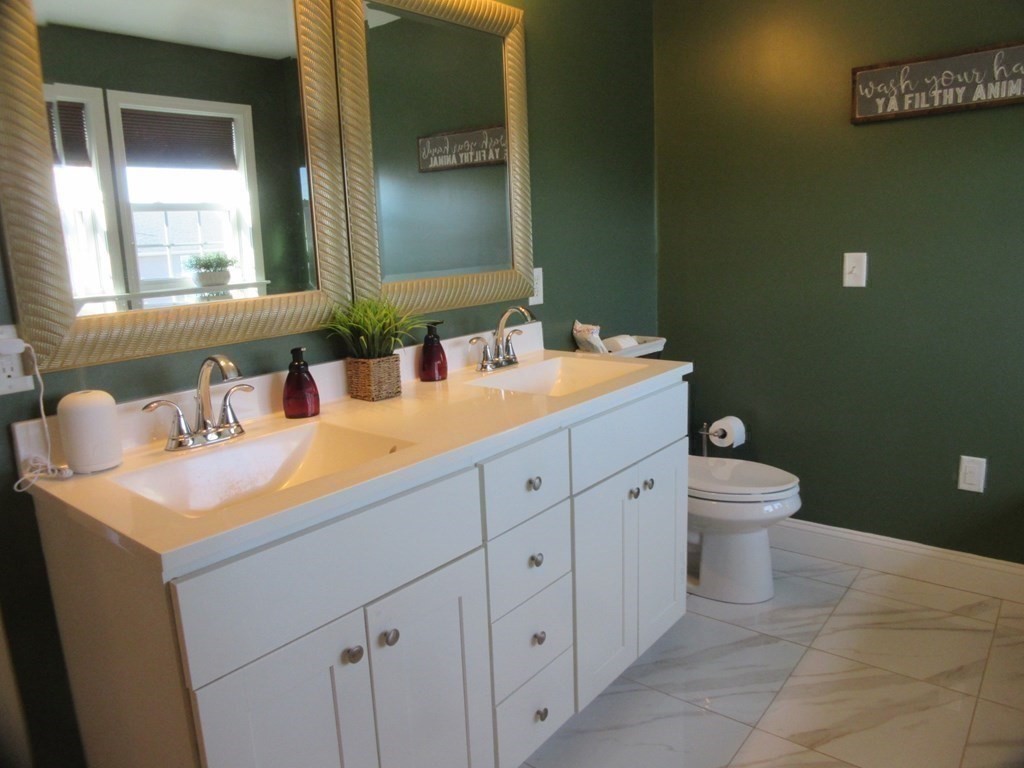 418 Smith Street Fall River, MA 02721 - Photo 27 of 37 a bathroom with a toilet sink and mirror