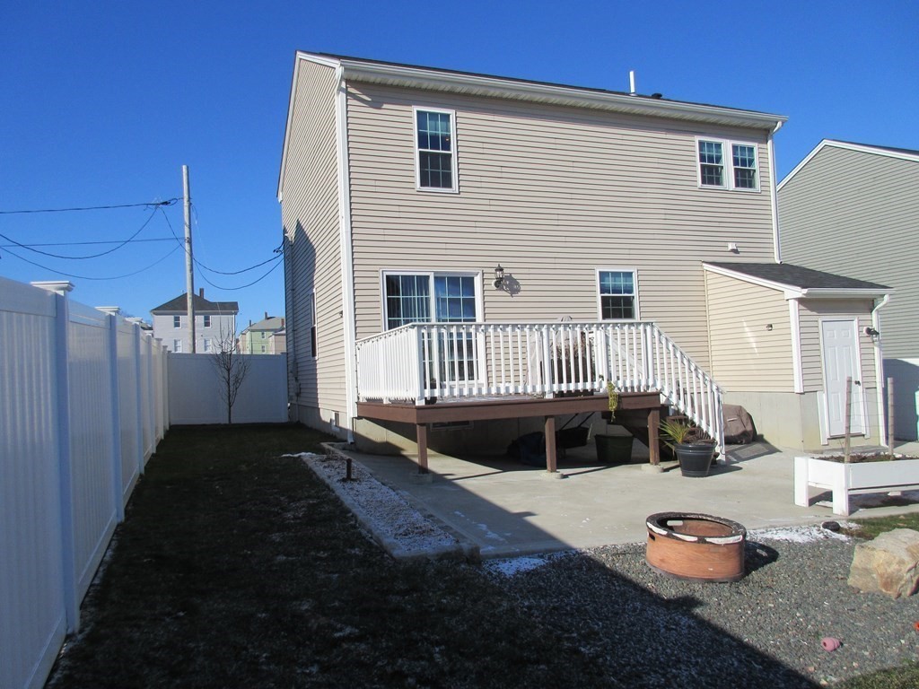 418 Smith Street Fall River, MA 02721 - Photo 3 of 37 a front view of a house with a yard