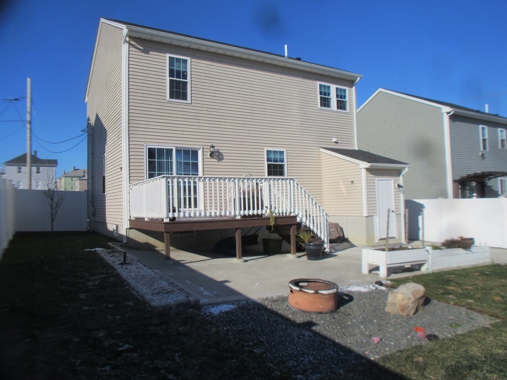 418 Smith Street Fall River, MA 02721 - Photo 4 of 37 a front view of a house with a yard