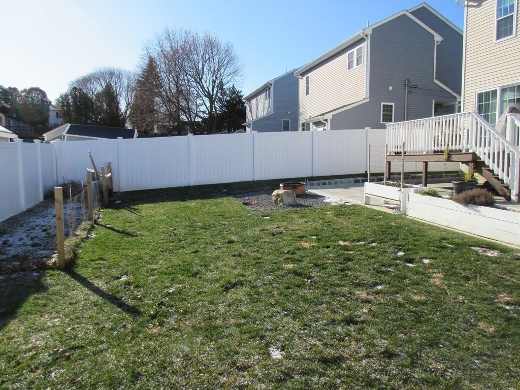 418 Smith Street Fall River, MA 02721 - Photo 7 of 37 a backyard of a house with lots of green space