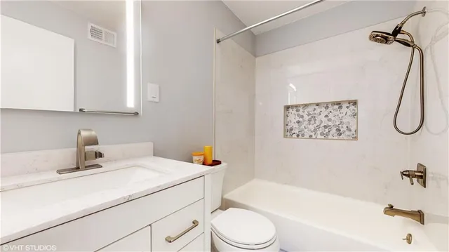 a bathroom with a sink a toilet and a bathtub