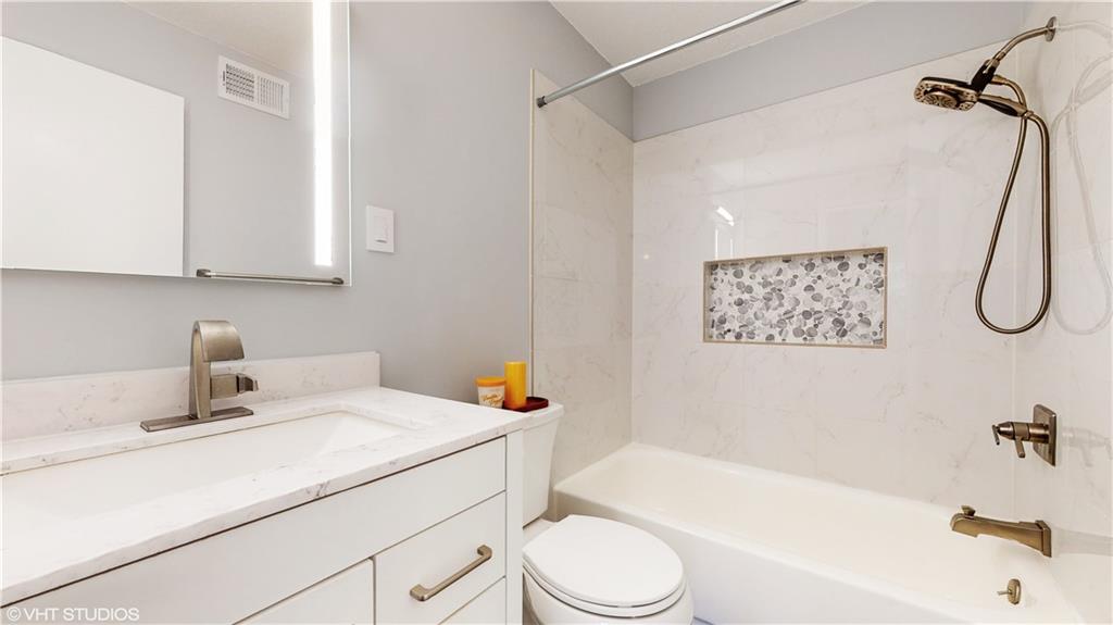 1177 Church Street, Unit C Decatur, GA 30030 - Photo 15 of 27 a bathroom with a sink a toilet and a bathtub