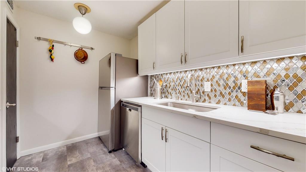 1177 Church Street, Unit C Decatur, GA 30030 - Photo 5 of 27 a kitchen with a sink and a refrigerator
