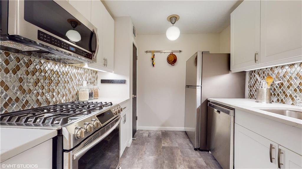 1177 Church Street, Unit C Decatur, GA 30030 - Photo 6 of 27 a kitchen with a stove and a refrigerator