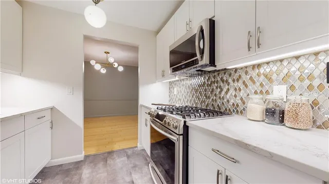 a kitchen with a stove and a microwave