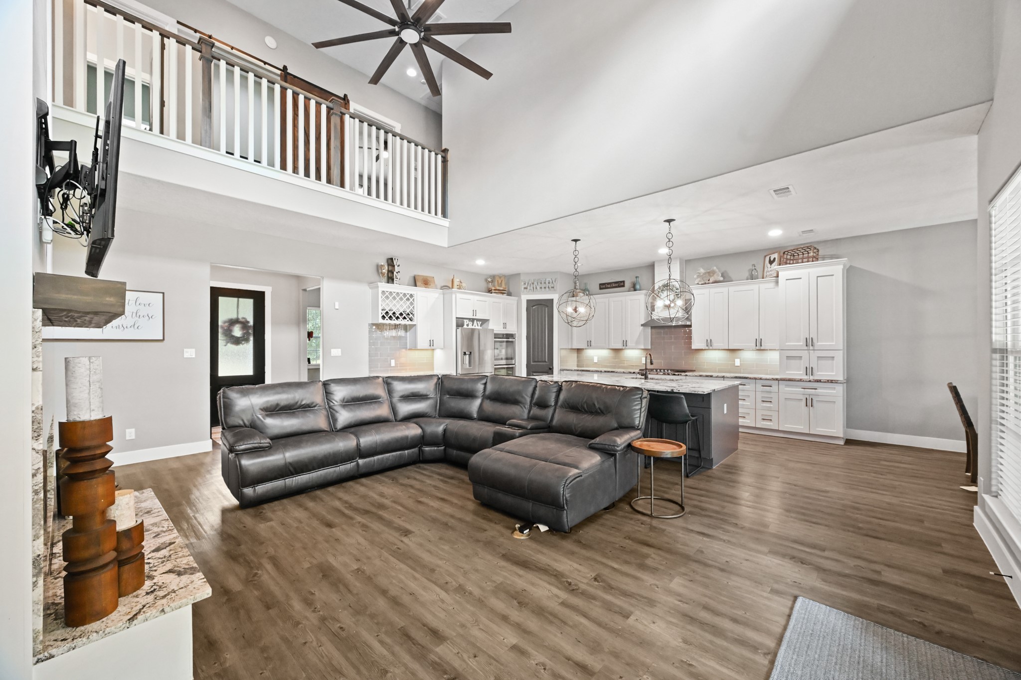16912 Wagon Wheel Road Stagecoach, TX 77355 - Photo 15 of 39 a living room with furniture and kitchen view