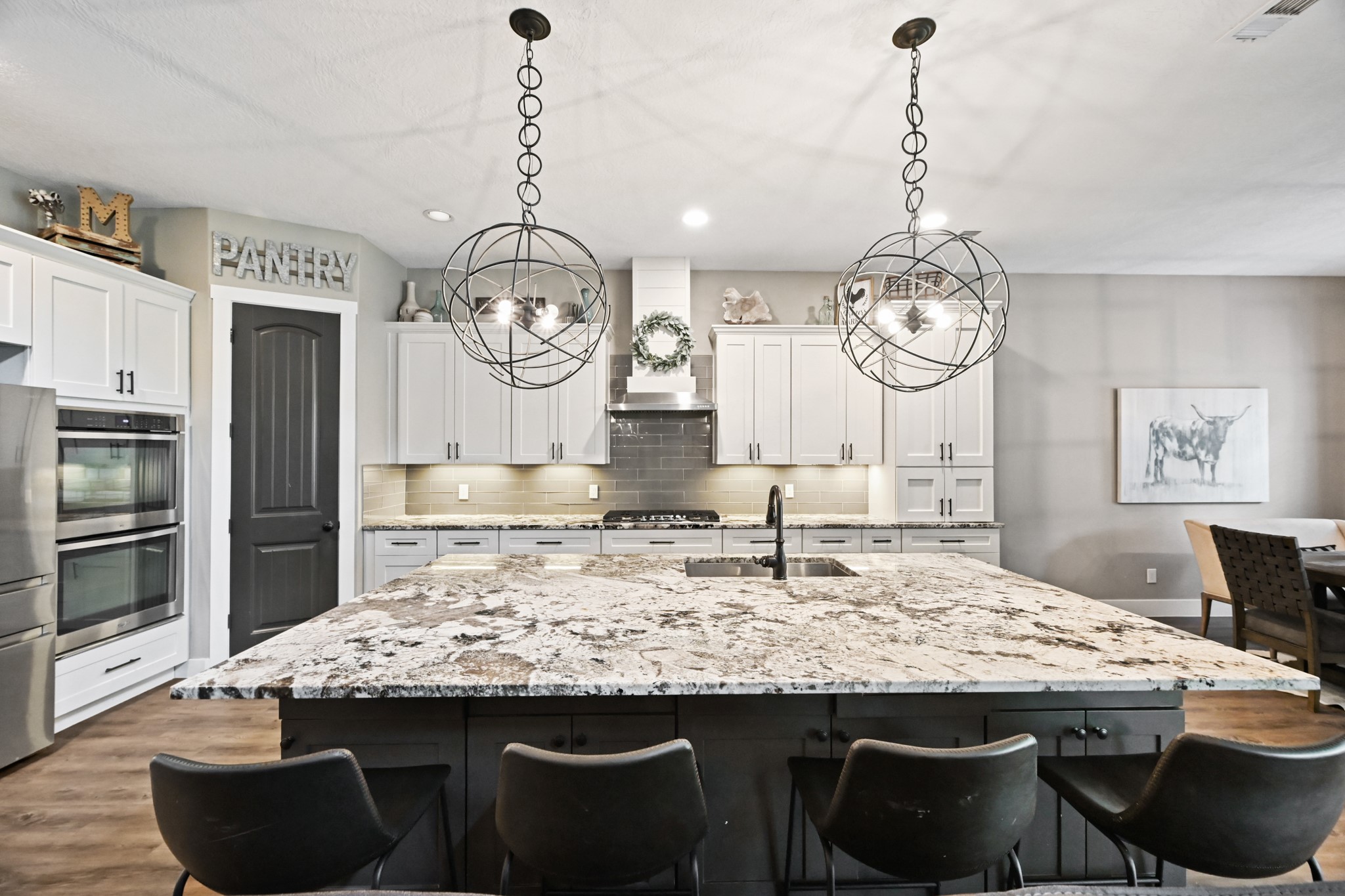 16912 Wagon Wheel Road Stagecoach, TX 77355 - Photo 16 of 39 a kitchen with a table and chairs in it