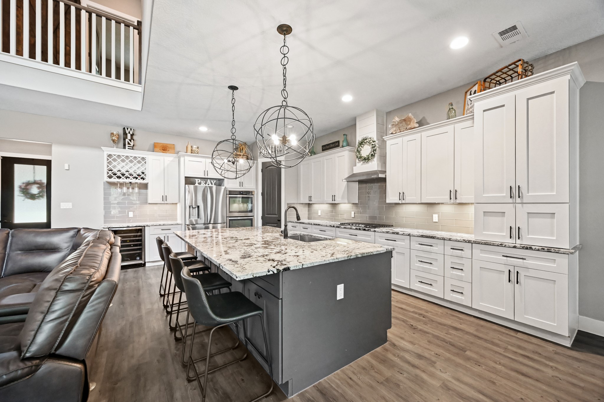 16912 Wagon Wheel Road Stagecoach, TX 77355 - Photo 18 of 39 a kitchen with cabinets counter space dining table and stainless steel appliances