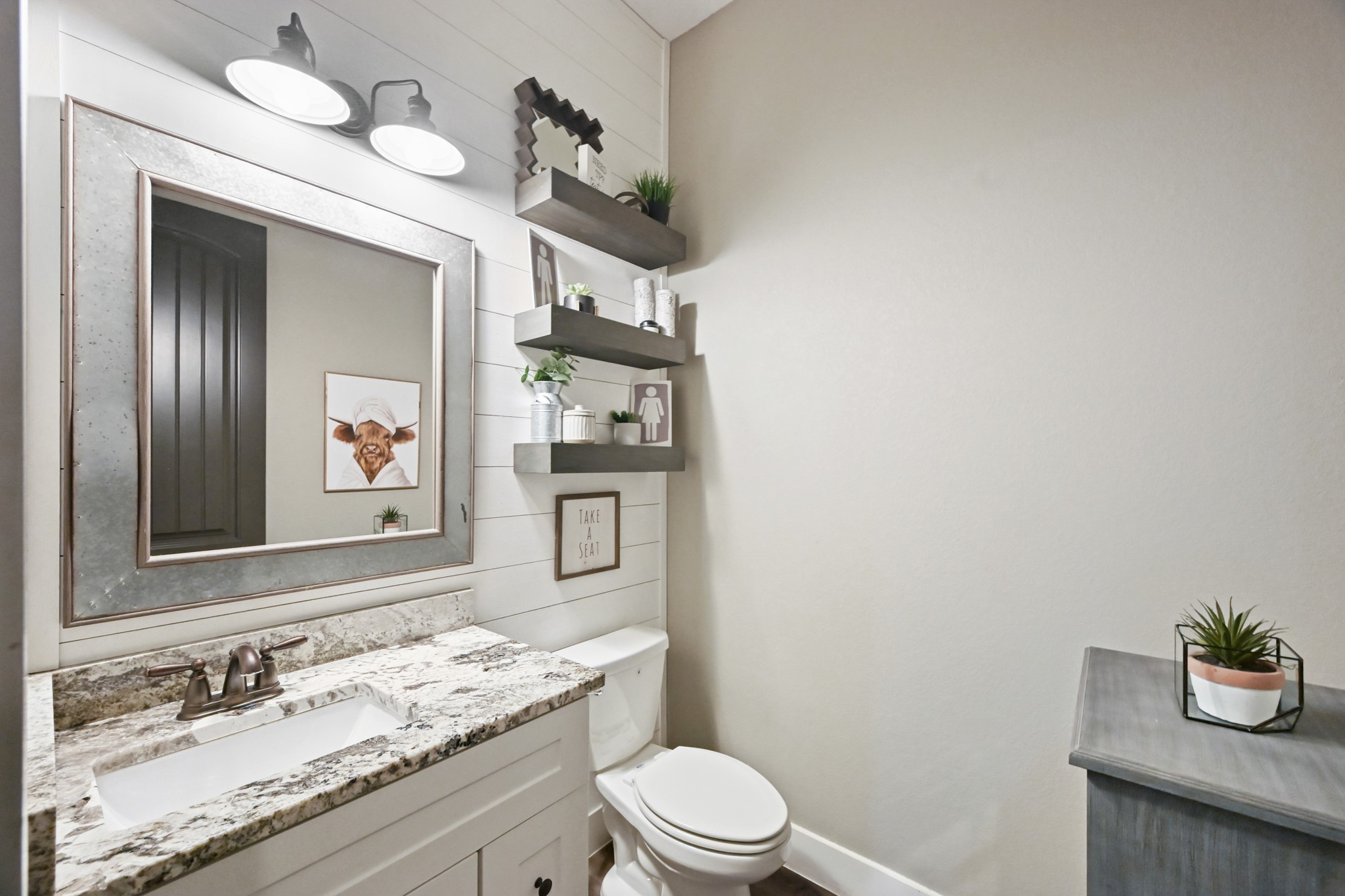 16912 Wagon Wheel Road Stagecoach, TX 77355 - Photo 29 of 39 a bathroom with a granite countertop sink mirror and toilet
