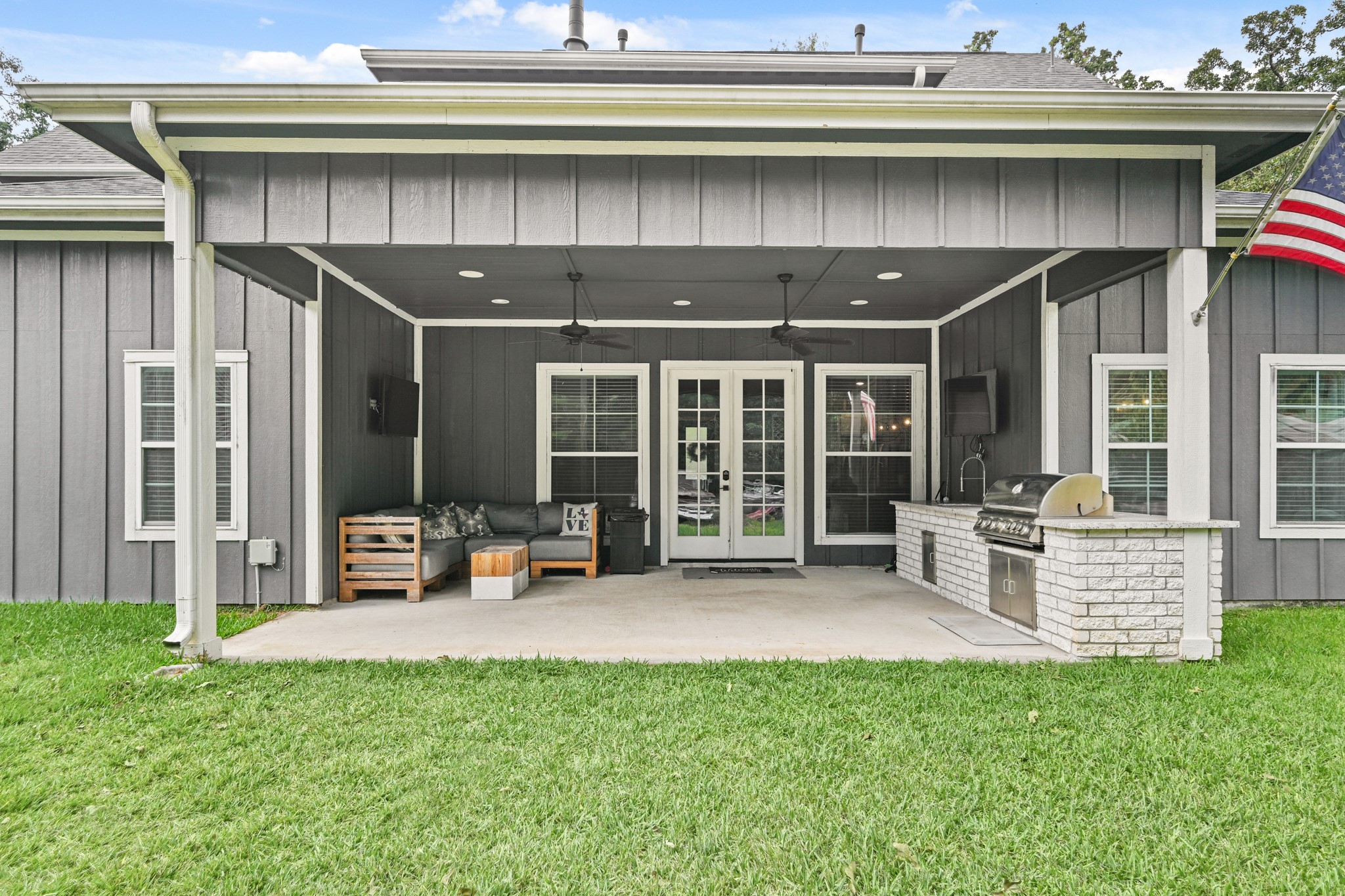 16912 Wagon Wheel Road Stagecoach, TX 77355 - Photo 31 of 39 Covered back patio featuring the Outdoor Kitchen and Grill area, perfect for entertaining guests.