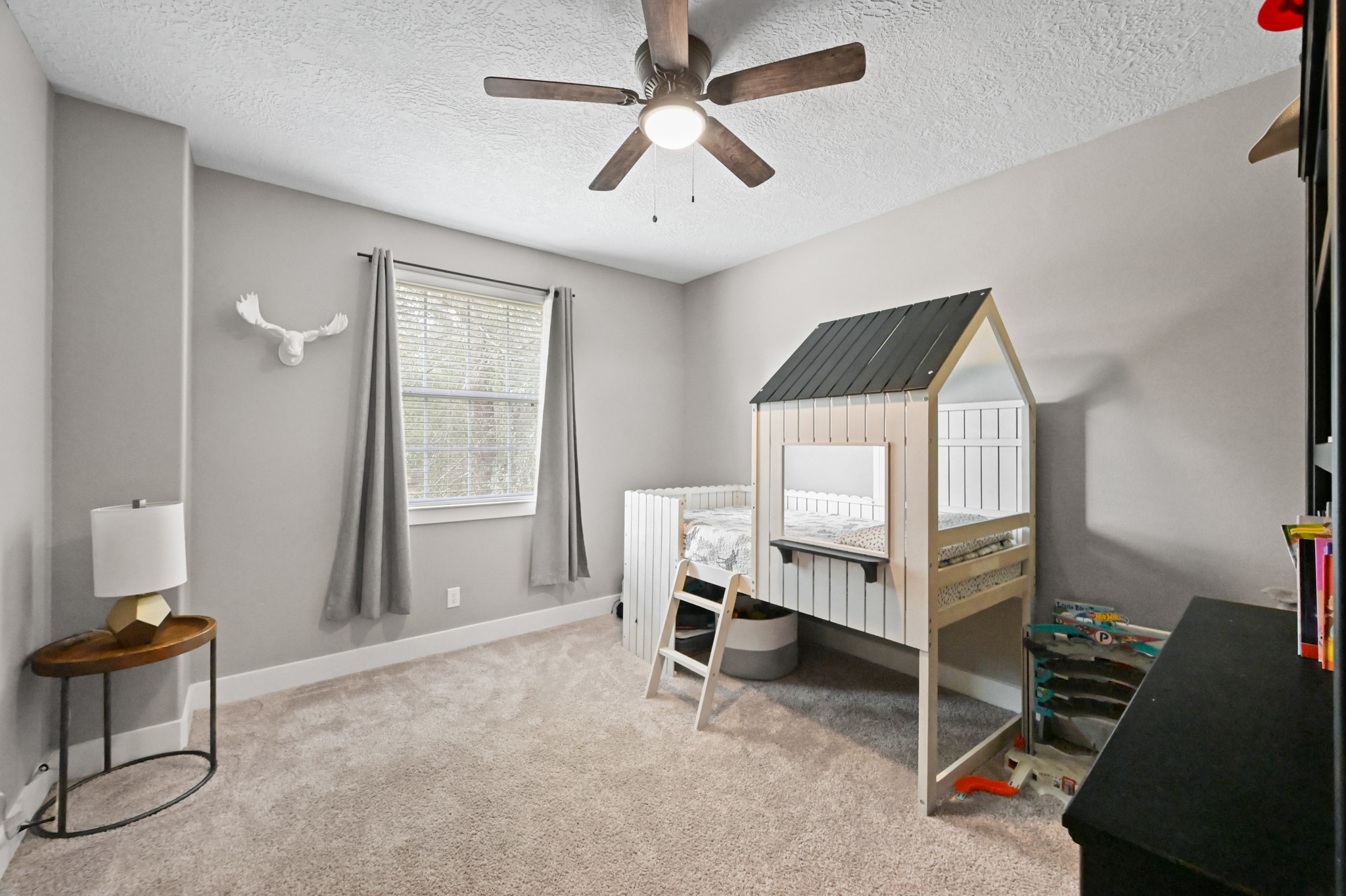 16912 Wagon Wheel Road Stagecoach, TX 77355 - Photo 35 of 39 a bedroom with furniture and a window