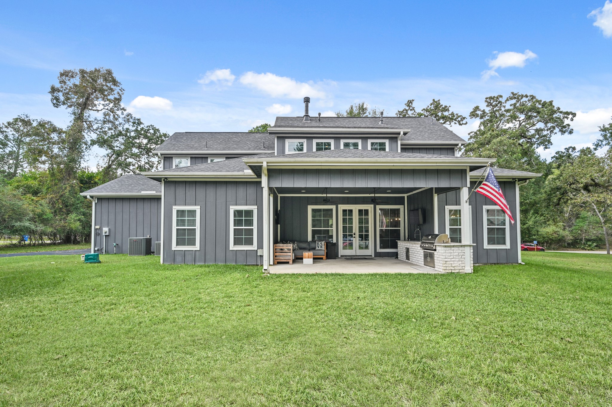 16912 Wagon Wheel Road Stagecoach, TX 77355 - Photo 39 of 39 a front view of a building with a garden and plants