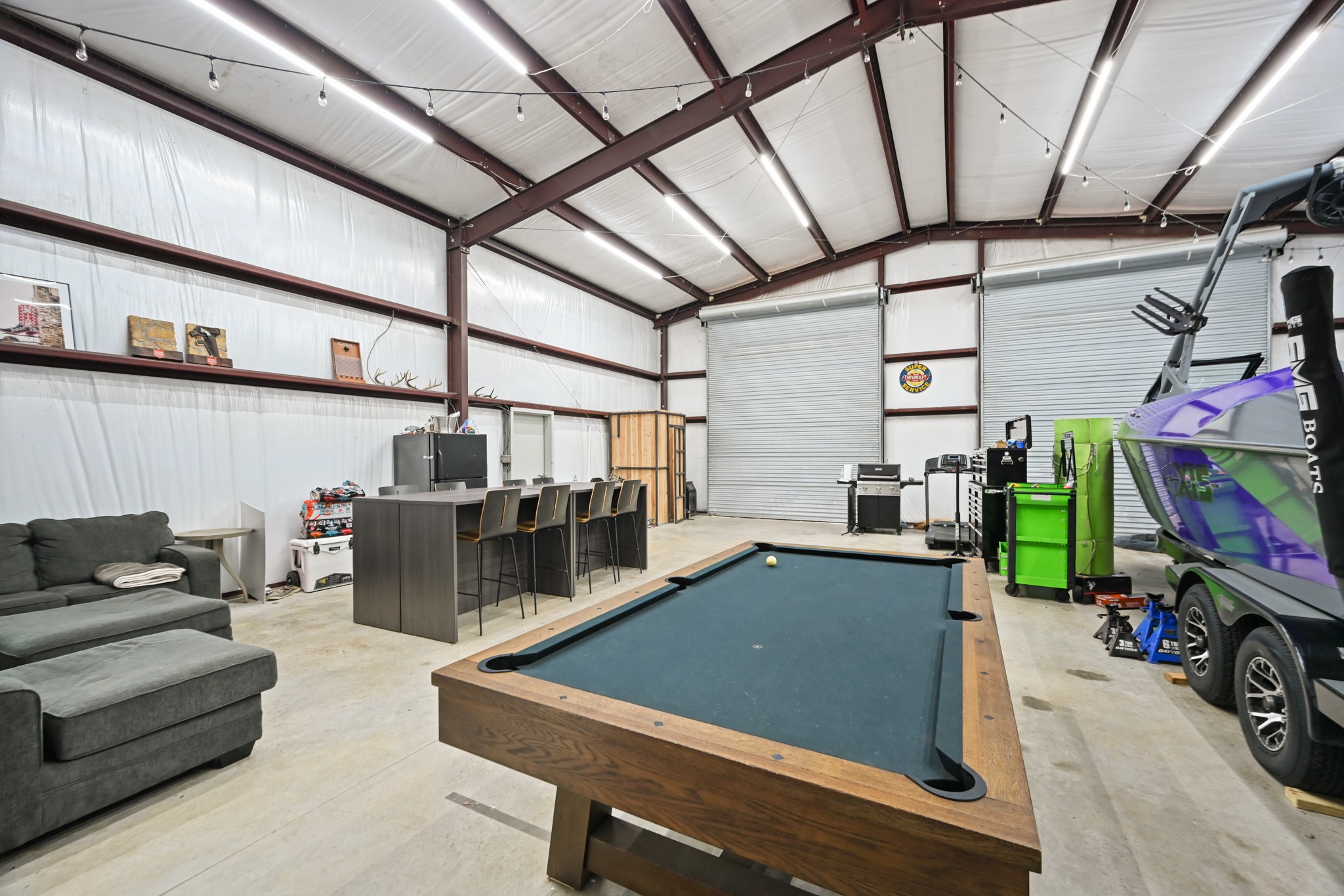 16912 Wagon Wheel Road Stagecoach, TX 77355 - Photo 8 of 39 a view of a living room with furniture and a flat screen tv