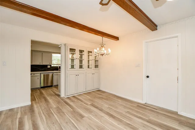 a view of a kitchen with a sink and cabinets