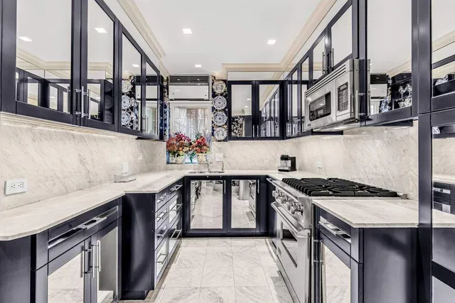 a bathroom with a granite countertop sink mirror and toilet