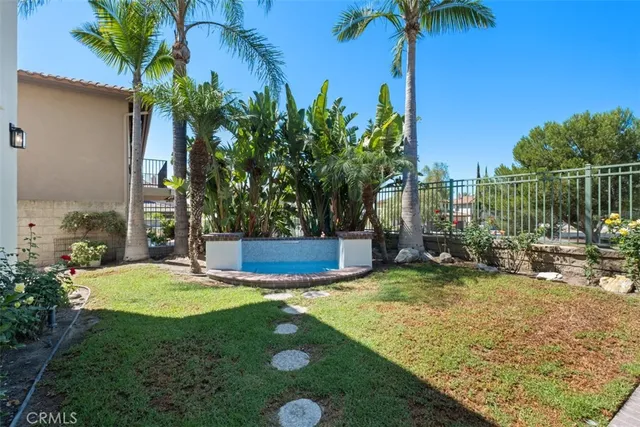 a view of a backyard with palm trees
