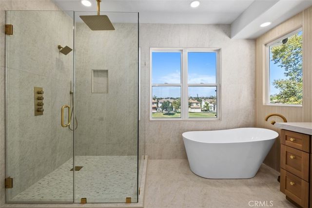 a bathroom with a bathtub and shower