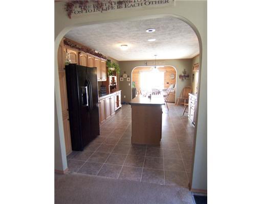 8 Berry Pit Road Hudson, ME 04449 - Photo 3 of 24 Kitchen. Graceful arch separates...