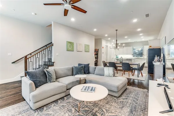 a large kitchen with kitchen island a dining table and chairs