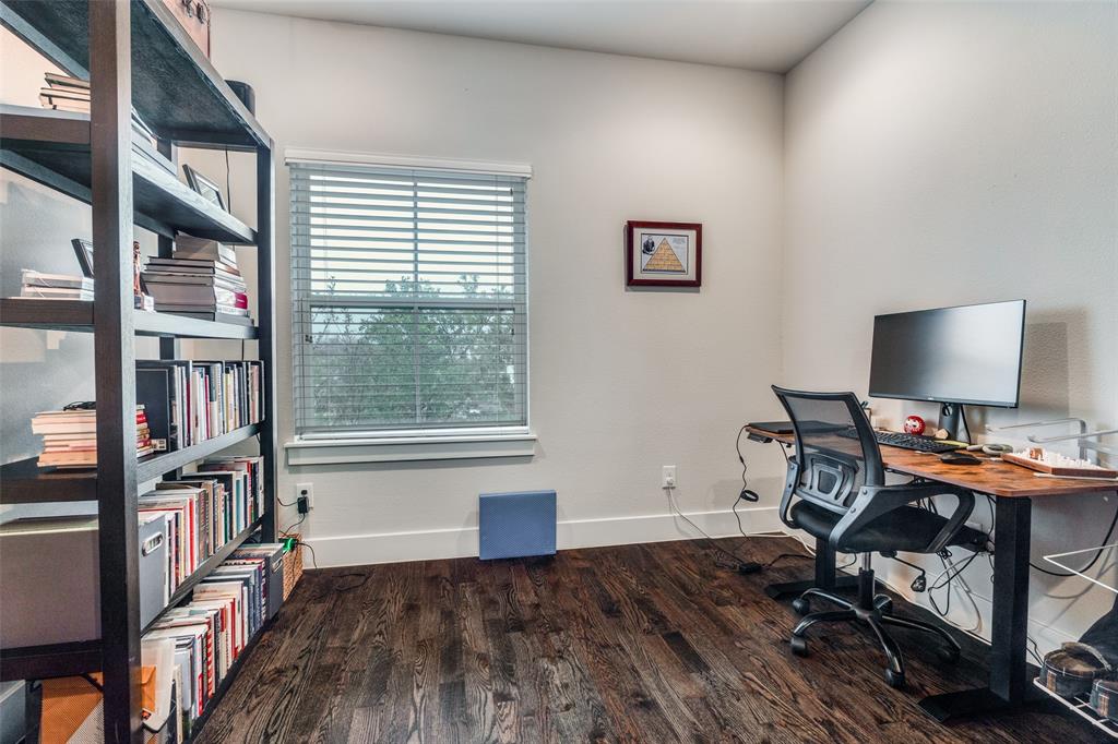 7700 Eastern Avenue, Unit 104 Dallas, TX 75209 - Photo 15 of 25 a view of a workspace with furniture and a bookshelf