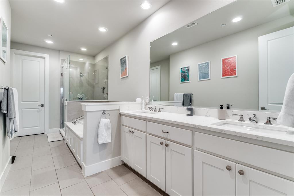 7700 Eastern Avenue, Unit 104 Dallas, TX 75209 - Photo 18 of 25 a spacious bathroom with a double vanity sink a mirror and a