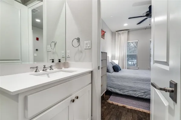 a bathroom with a sink a bathtub and shower