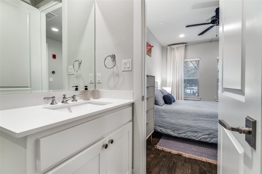 7700 Eastern Avenue, Unit 104 Dallas, TX 75209 - Photo 22 of 25 a en suite bathroom with a sink and a mirror