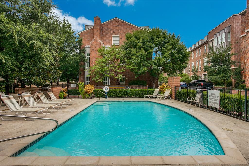 7700 Eastern Avenue, Unit 104 Dallas, TX 75209 - Photo 25 of 25 a view of a swimming pool with a lounge chairs